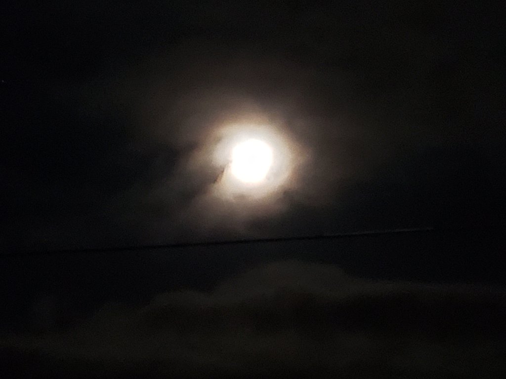 Full moon in dark cold sky black 