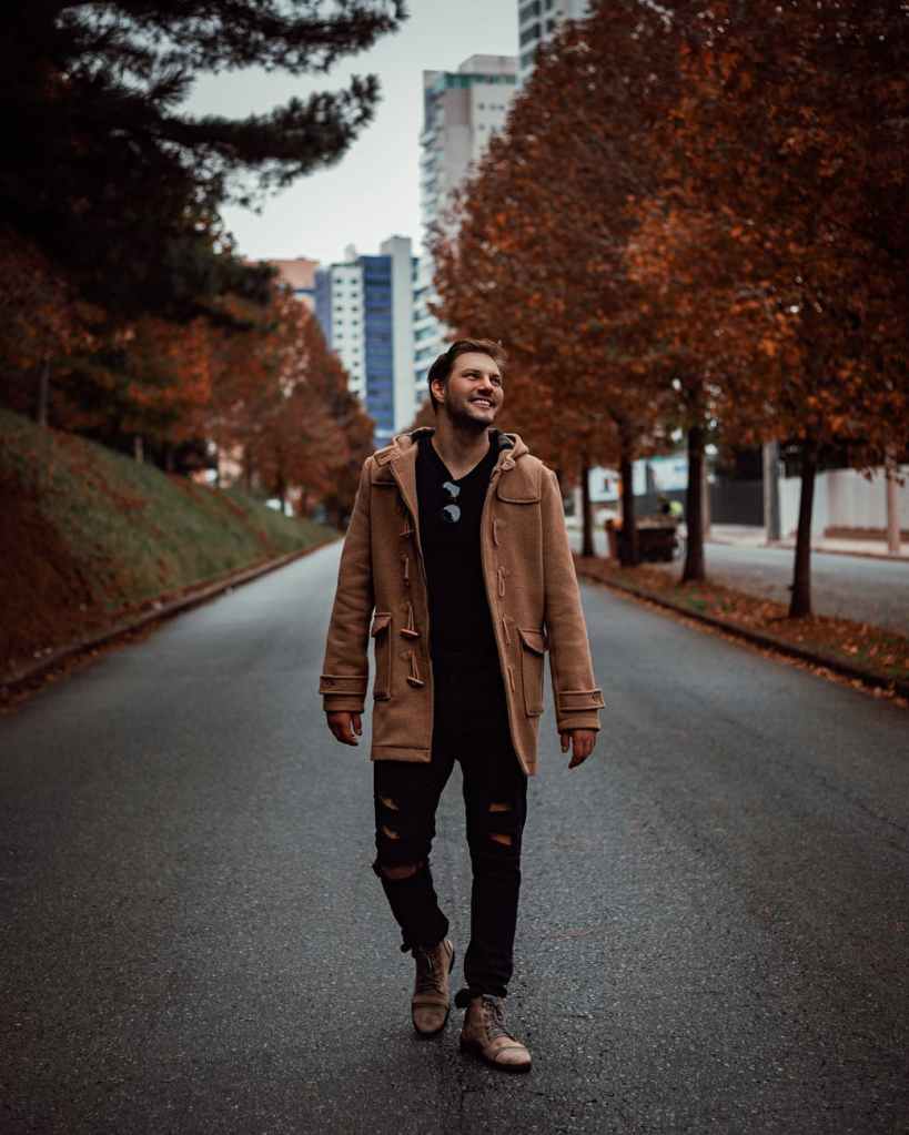 Male walking in the fall street. Stock image 