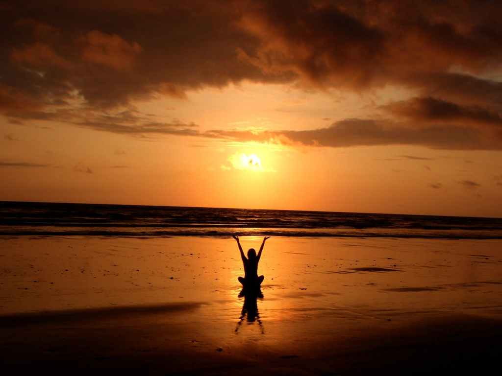 Mediation on the beach during sunset
