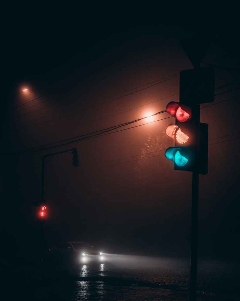 Traffic lights during a dark, rainy night