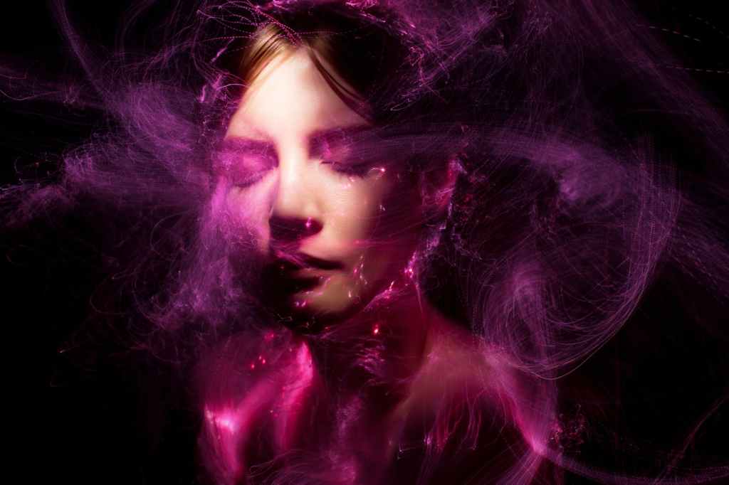Woman encircled by magic purple in this pexel stock photography