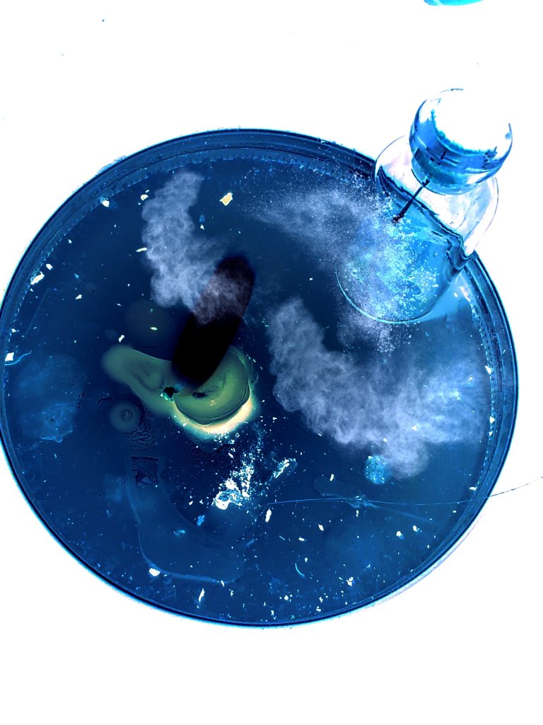 Edited image of candle and bottle in negative format original Dr. Digital Philosophy Photography 2021