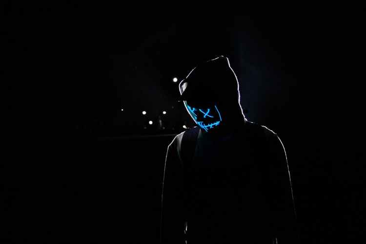 Splash image of a hood figure with blue highlighted face