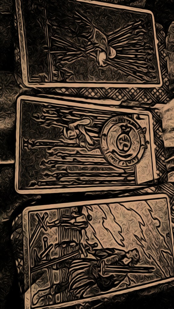 Tarot Card spread with 10 of wands, 9 of wands and 5 of Swords original image